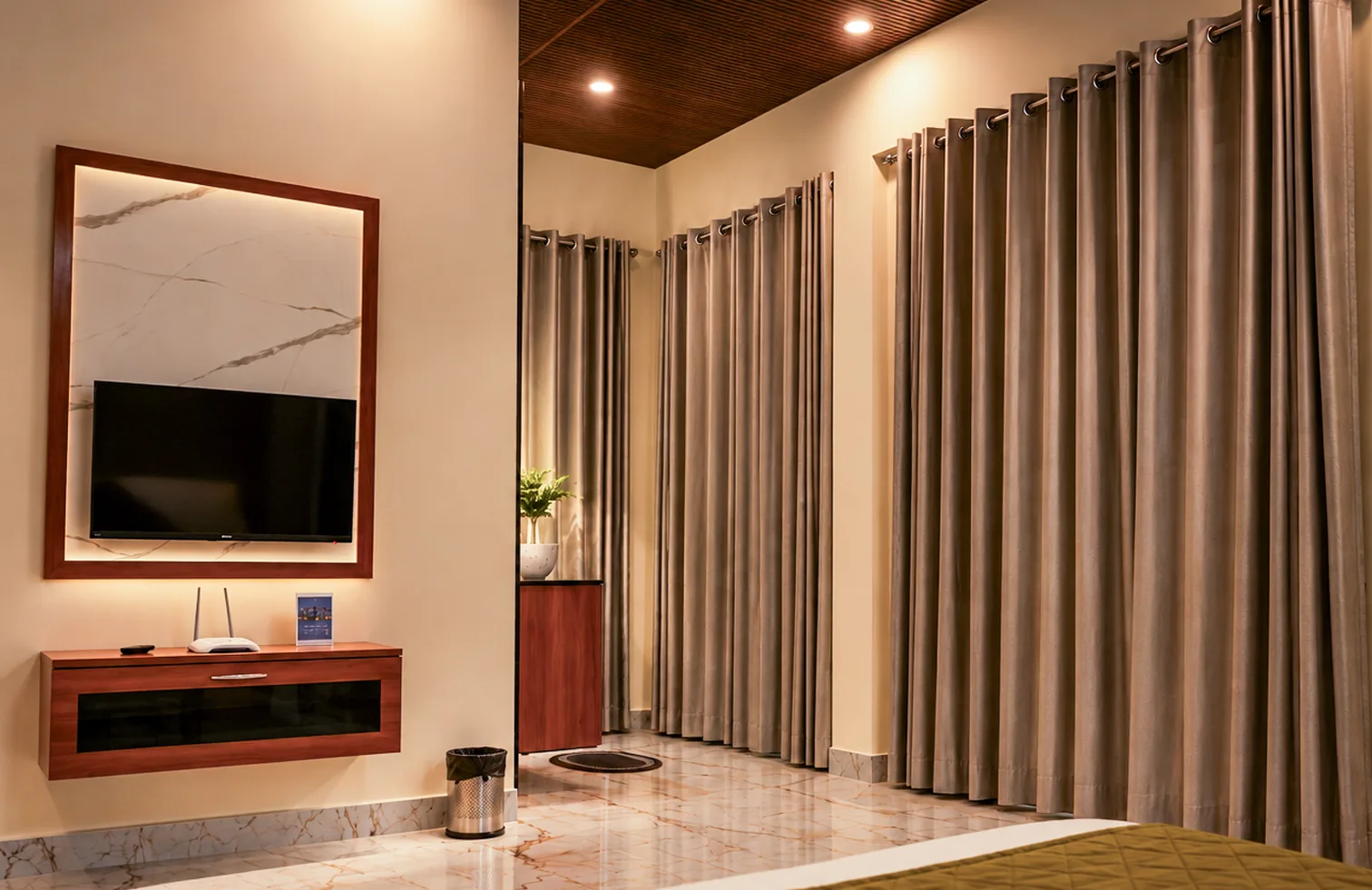 Warm premium room interior at Gayathri Nest